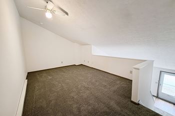 Vaulted ceilings (with ceiling fans) in loft apartment homes